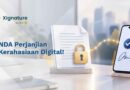 Foto dua orang berjabat tangan menandatangani NDA digital di tablet