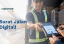 Foto sopir truk menyerahkan surat jalan digital ke penerima barang di gudang