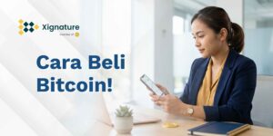 Ponsel menampilkan aplikasi Bitcoin dengan ikon perisai terverifikasi di samping koin emas